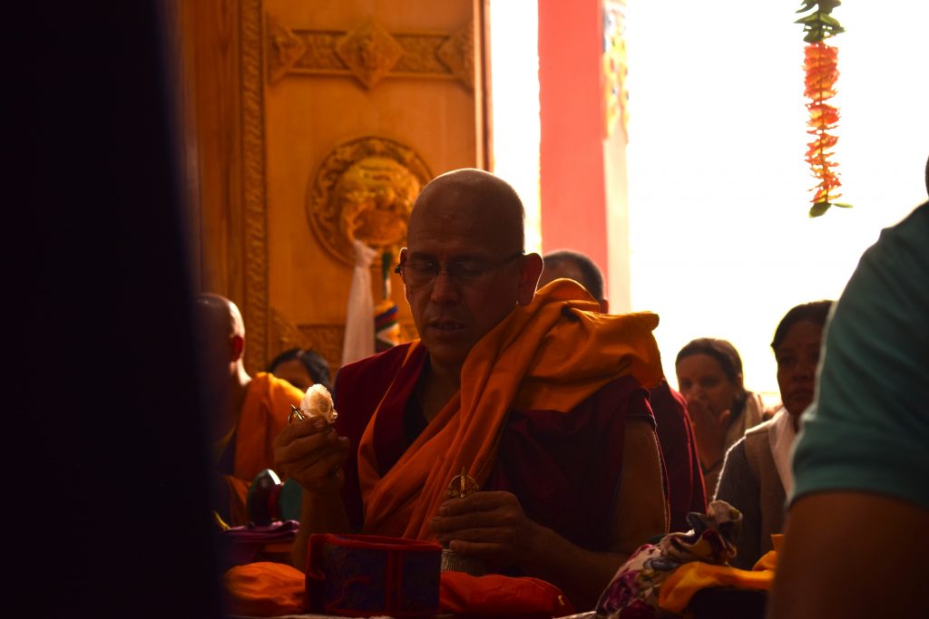 A senior monk performing rituals